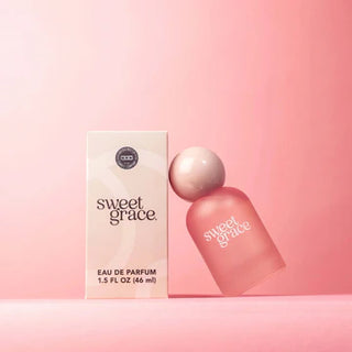 Sweet Grace perfume bottle and packaging on a pink background