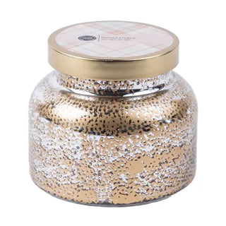 Decorative jar with gold and white speckled design on a white background
